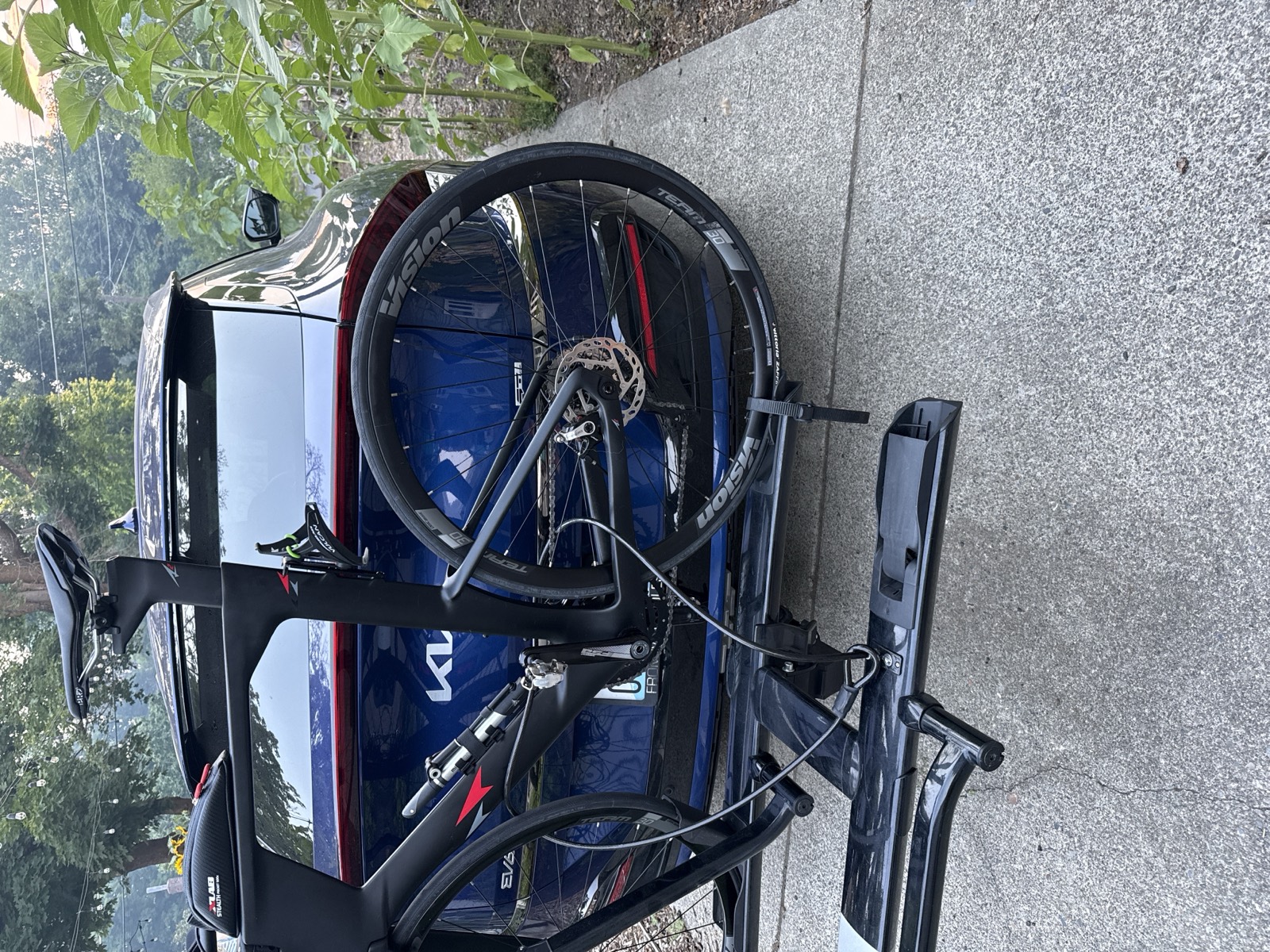 My triathlon bike racked on the back of our Kia EV6, loaded up to leave home for the drive to Oregon