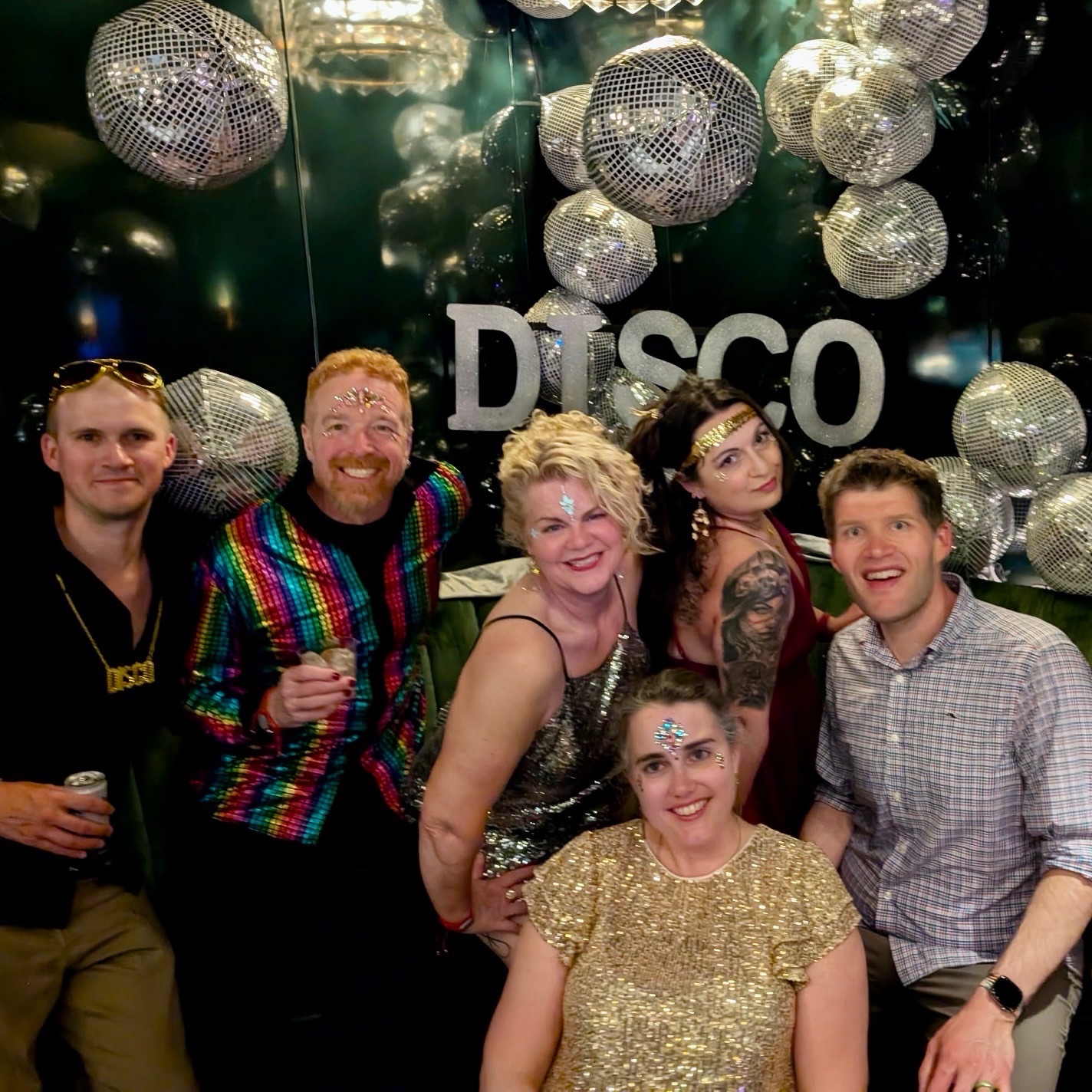 Disco Night group photo with friends aboard Brilliant Lady